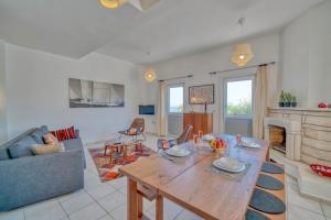 a living room with a table and a couch at Villa Pilu in Kaş