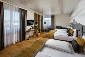 מיטה או מיטות בחדר ב-Hotel Allegra Lodge