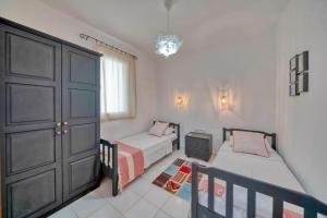 a bedroom with two twin beds and a closet at Villa Pilu in Kaş +27 photos