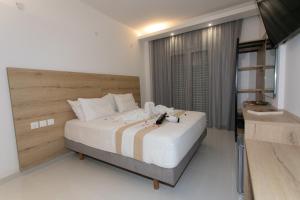 Postel nebo postele na pokoji v ubytování Hotel Philoxenia
