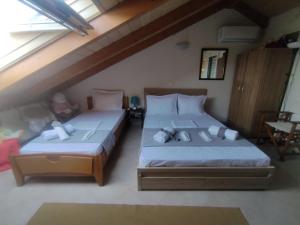 A bed or beds in a room at AB Preveza Apartments -15 Meters Over the Sea