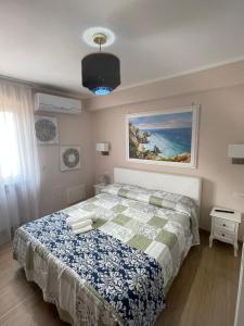 Кровать или кровати в номере Residenza le sirene