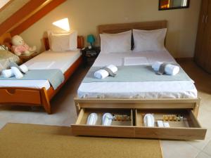 A bed or beds in a room at AB Preveza Apartments -15 Meters Over the Sea
