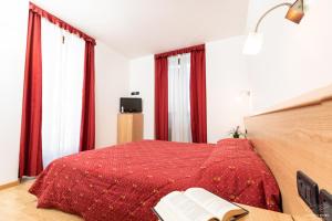 Postel nebo postele na pokoji v ubytování Hotel Posta