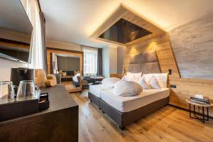 Postel nebo postele na pokoji v ubytování Hotel Faloria