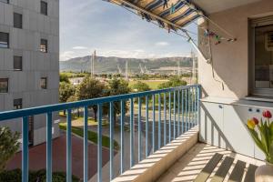 a balcony with a view of a river and mountains at Hana City Apartment in Split