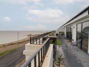 a house with a balcony with a view of the ocean at Flat 10 in Clacton-on-Sea
