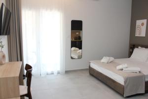 Cama ou camas em um quarto em UrbanBay Hotel & Spa