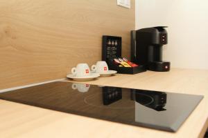Comodidades para preparar café e chá em UrbanBay Hotel & Spa