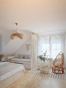 Posteľ alebo postele v izbe v ubytovaní FORMA Apartament Supraśl