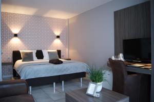 Postel nebo postele na pokoji v ubytování B&B Maison Kerkhove