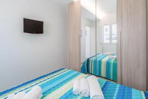 Letto o letti in una camera di Apt Giulia a due passi dal mare