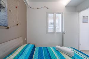 Letto o letti in una camera di Apt Giulia a due passi dal mare