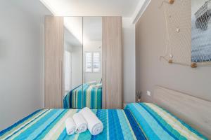Letto o letti in una camera di Apt Giulia a due passi dal mare