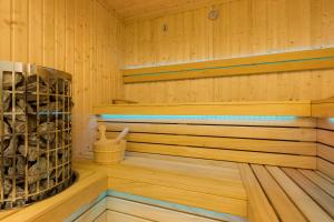 a wooden cabin with a sauna at Underground Apartment in a Lux Holiday House Posejdon by Renters Prestige in Kołczewo