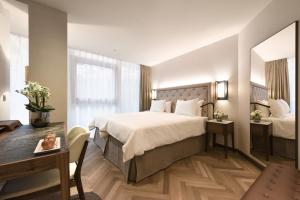 Postel nebo postele na pokoji v ubytování Hotel Astoria