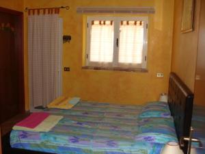 Ein Bett oder Betten in einem Zimmer der Unterkunft Guroneddu