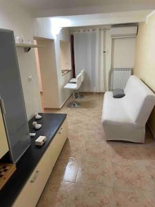 Ein Sitzbereich in der Unterkunft Mini appartamento” La Casetta”
