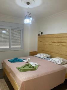 Säng eller sängar i ett rum på Villa Olymposzaray