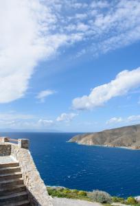 a view of the ocean from a stone wall at Uranos Studios in Amorgos