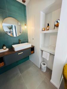 a bathroom with a sink and a mirror at B&B 366 in Vrboska