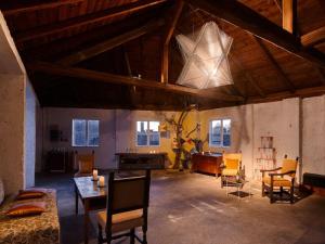 a large living room with a table and chairs at Schloß Hollenburg Honeymoon Suite in Krems an der Donau