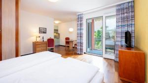Letto o letti in una camera di Hapimag Resort Ascona