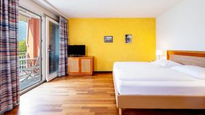 Letto o letti in una camera di Hapimag Resort Ascona