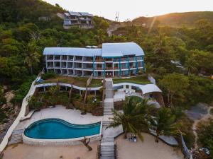 an aerial view of a resort with a swimming pool at Inlight Lombok Beach Hotel in Kuta Lombok
