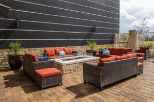 a patio with wicker chairs and a fire pit at Fairfield Inn & Suites by Marriott Menifee in Menifee