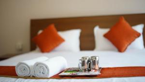 Tempat tidur dalam kamar di Hotel Pala