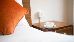 Tempat tidur dalam kamar di Hotel Pala