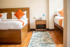Tempat tidur dalam kamar di Hotel Pala