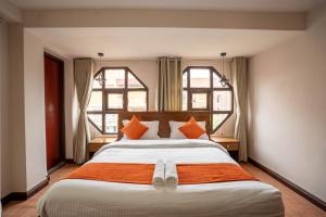 Tempat tidur dalam kamar di Hotel Pala