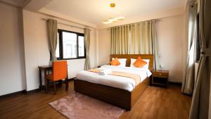 Tempat tidur dalam kamar di Hotel Pala