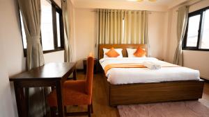 Tempat tidur dalam kamar di Hotel Pala