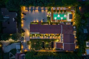 an overhead view of a building at night with lights at Resort Miramonti in Forte dei Marmi