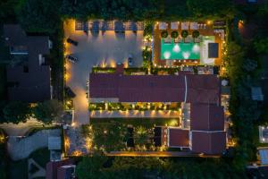 an overhead view of a building at night with lights at Resort Miramonti in Forte dei Marmi