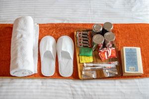 Tempat tidur dalam kamar di Hotel Pala