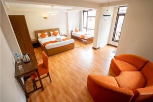 Tempat tidur dalam kamar di Hotel Pala