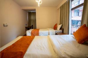 Tempat tidur dalam kamar di Hotel Pala