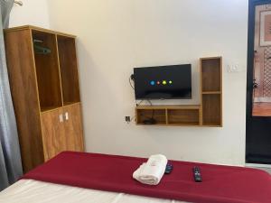 TV tai viihdekeskus majoituspaikassa HOLLYWOOD Rooms