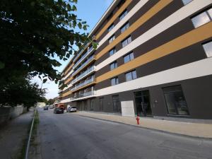 an empty street in front of a building at Апартаменти Жилищна сграда Орех in Varna City