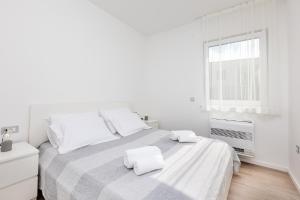 Postel nebo postele na pokoji v ubytování Apartments Aqua