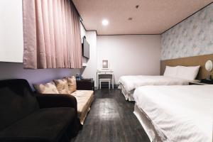 Letto o letti in una camera di Sofu Hotel
