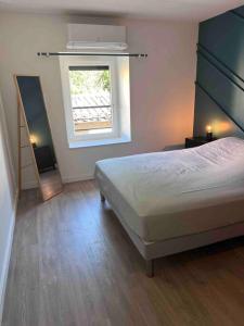 Giường trong phòng chung tại Gîte Anna