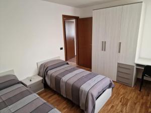 Postel nebo postele na pokoji v ubytování Appartamento LA CONCA, Alpago