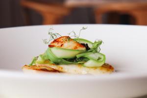 a piece of food on a white plate at Housel Bay Hotel in Lizard