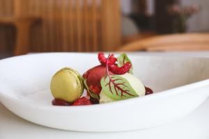 a bowl of fruit on a white plate at Housel Bay Hotel in Lizard