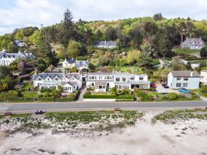 an aerial view of a house on the beach at Neptune Cottage in Rockcliffe